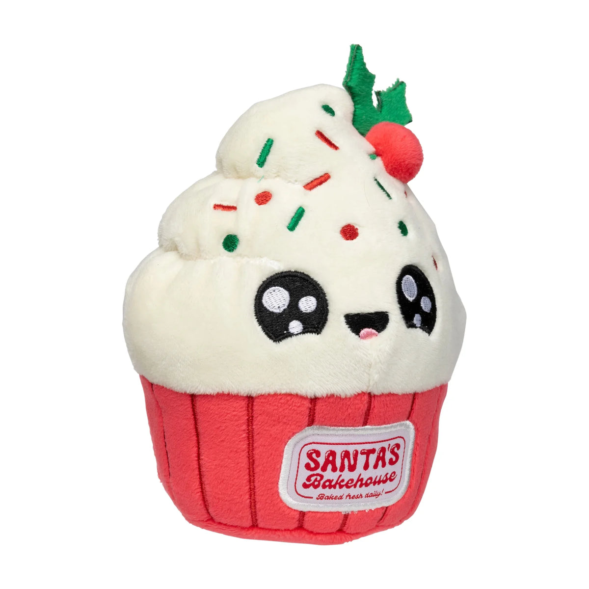 A FuzzYard Frosty The Cupcake plush Christmas dog toy with white frosting, red wrapper, colorful sprinkles, a green holly leaf, and a red cherry on top. The wrapper has a visible 'Santa's Bakehouse' label.