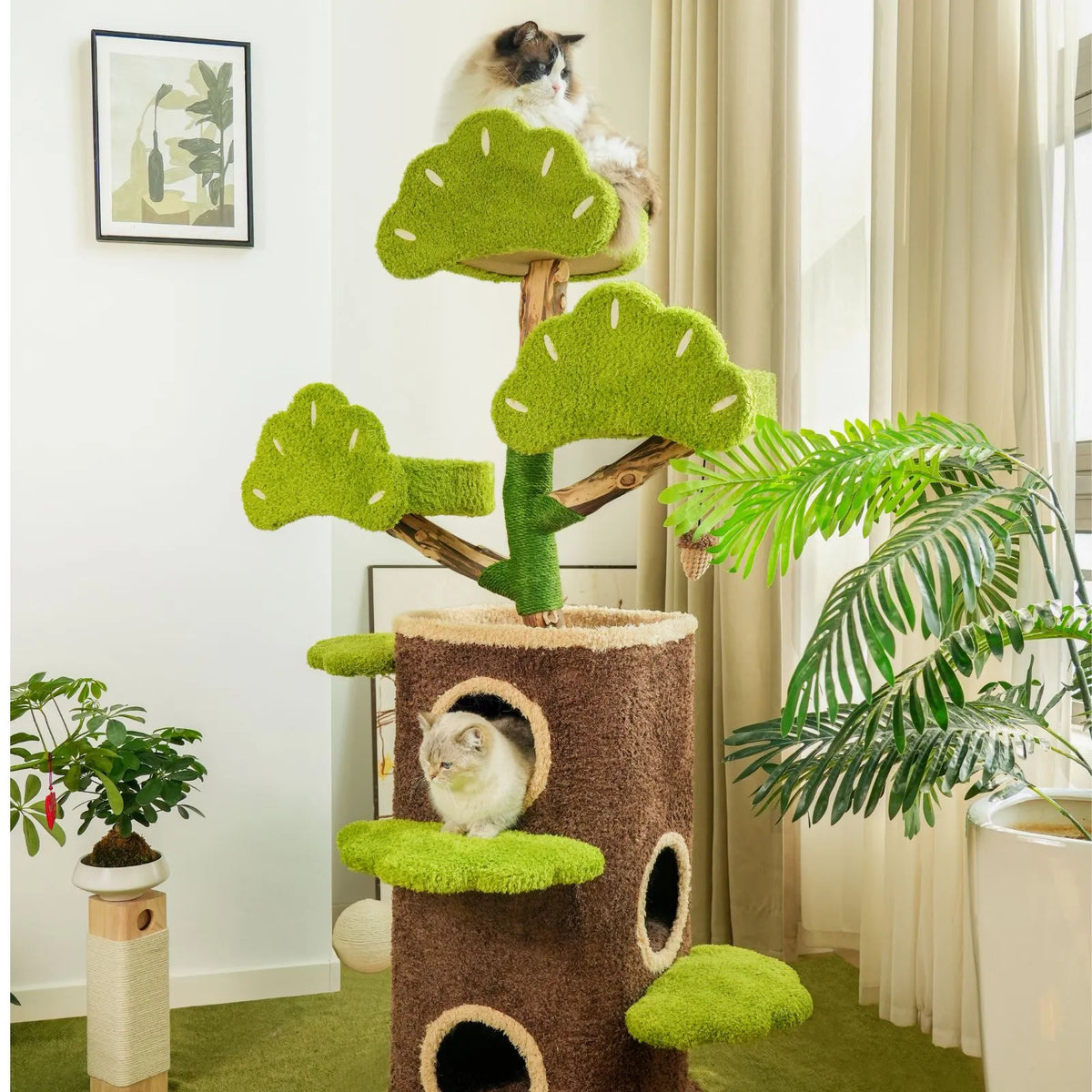 Petoria Bonsai Cat Tree with two enclosed dens, green leaf-shaped platforms and a hanging pinecone toy.
