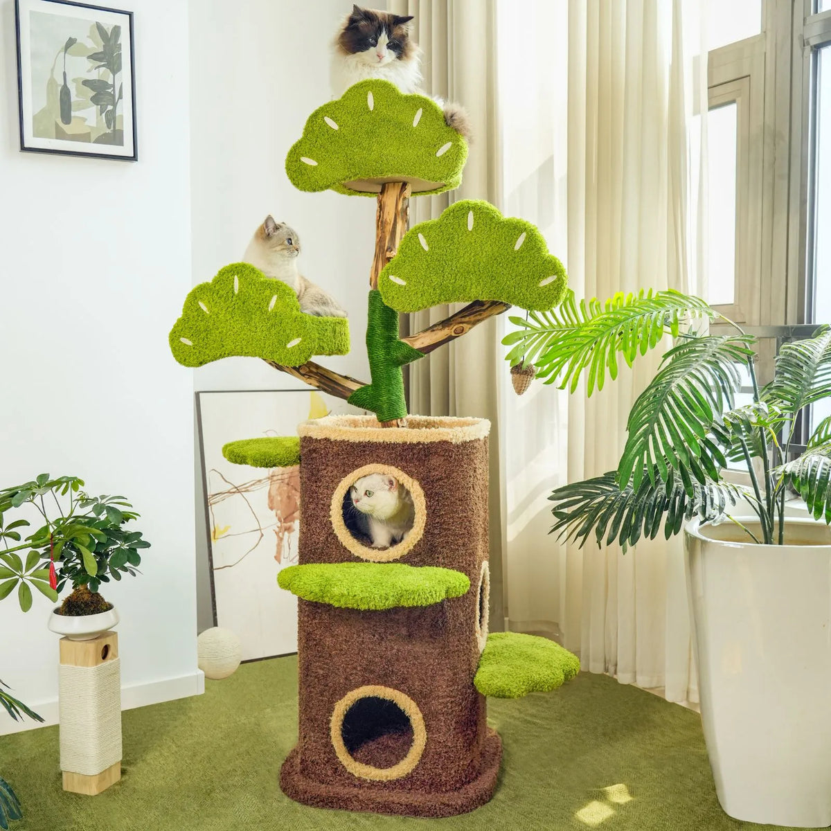 Petoria Bonsai Cat Tree with two enclosed dens, green leaf-shaped platforms and a hanging pinecone toy.