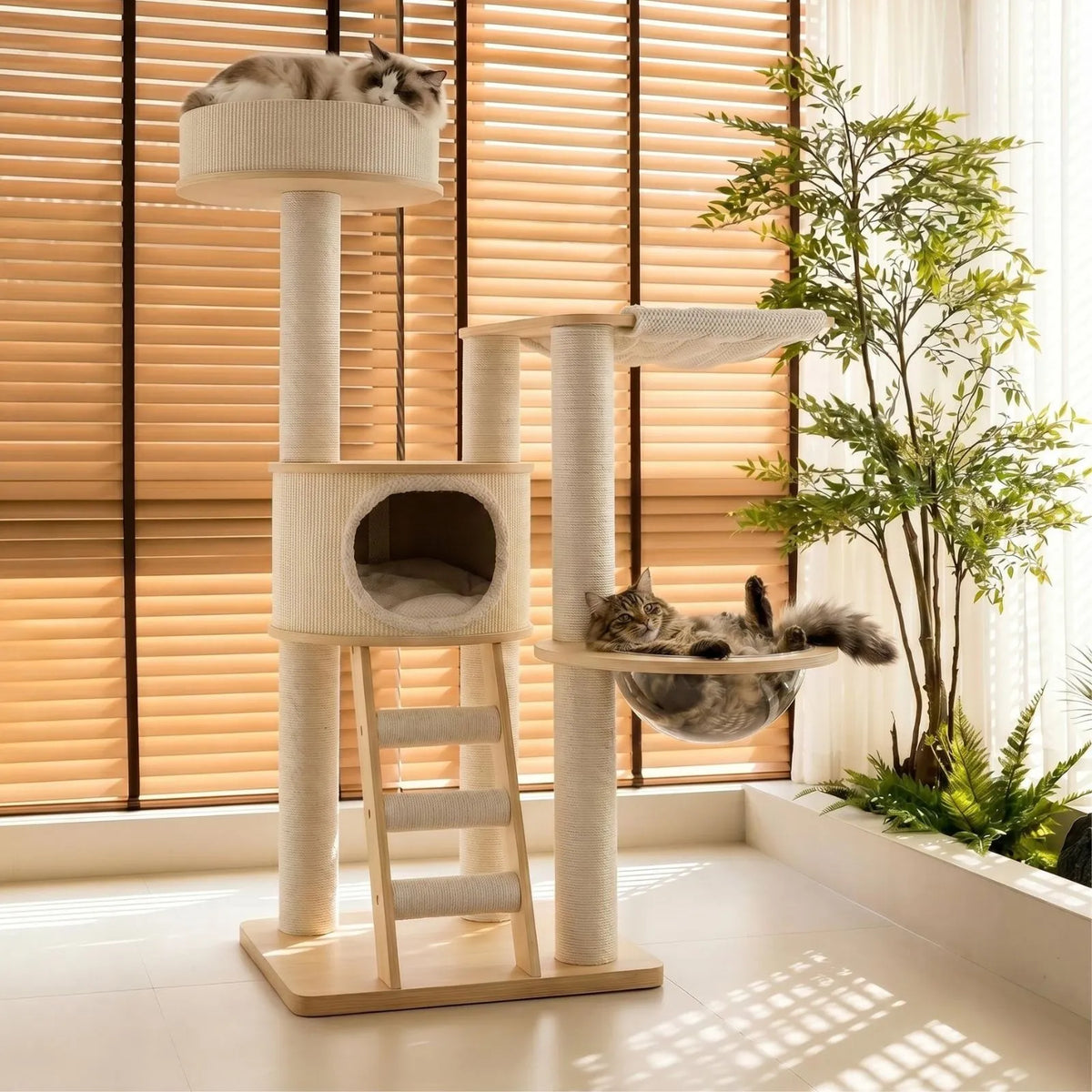 A tall Petoria Grove Ladder cat tree with sisal-wrapped posts, a top platform, a ladder, a small enclosed cat bed, and a hanging perch, shown in a bright room with window blinds and two cats resting on it.