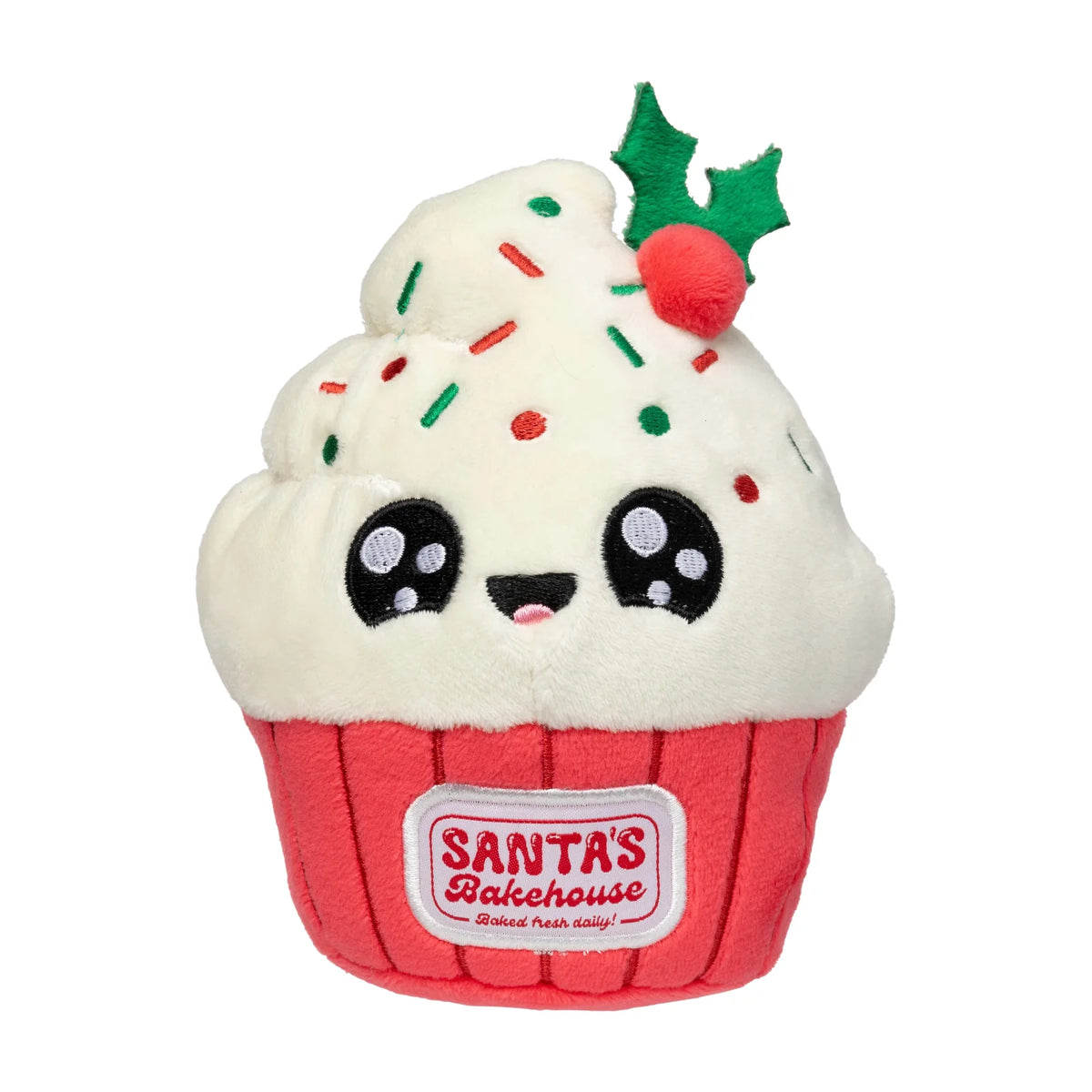 A plush FuzzYard Frosty The Cupcake plush Christmas dog toy with white frosting, red wrapper, colorful sprinkles, a green holly leaf, and a red berry on top. The wrapper has a visible label reading 'SANTA'S Bakehouse'.