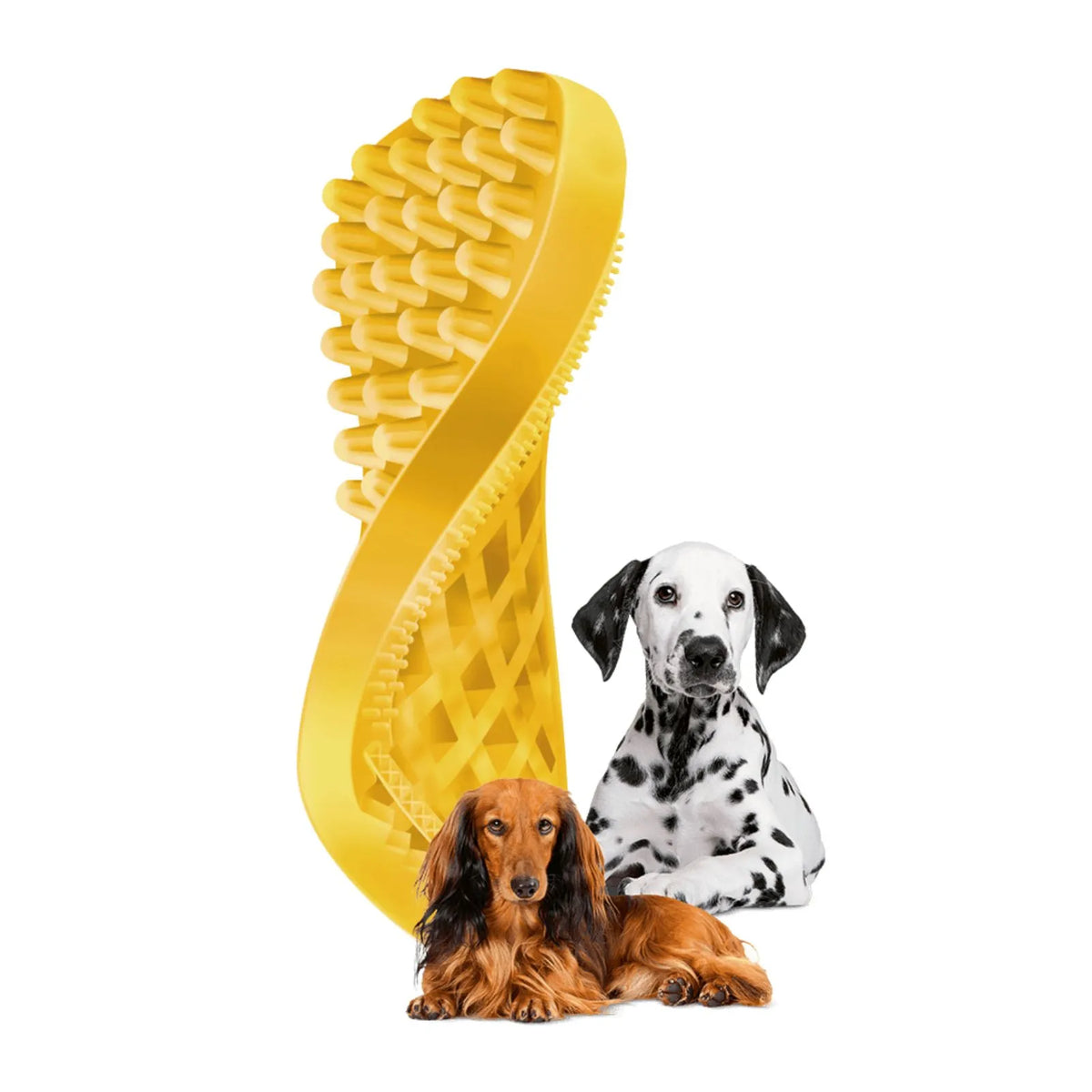 A yellow silicone Pet & Me grooming brush shaped like a shoe sole, shown with two dogs—a long-haired brown dog lying down and a Dalmatian sitting—on a plain white background.