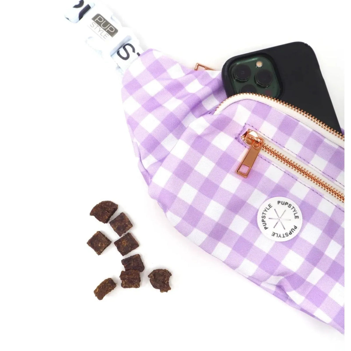 A Pupstyle Berry Milkshake Dog Parent Bum Bag with a rose gold zipper, shown with a smartphone and dog treats on a white background.