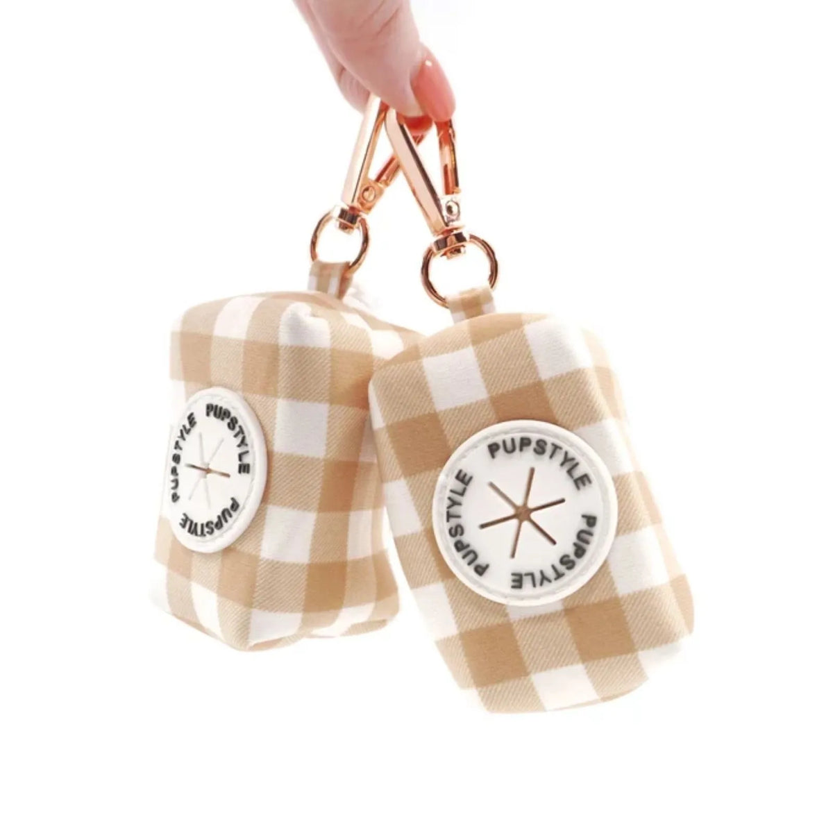 Two Pupstyle Creme Brulee Dog Poop Bag Holder with rose gold snap clip.
