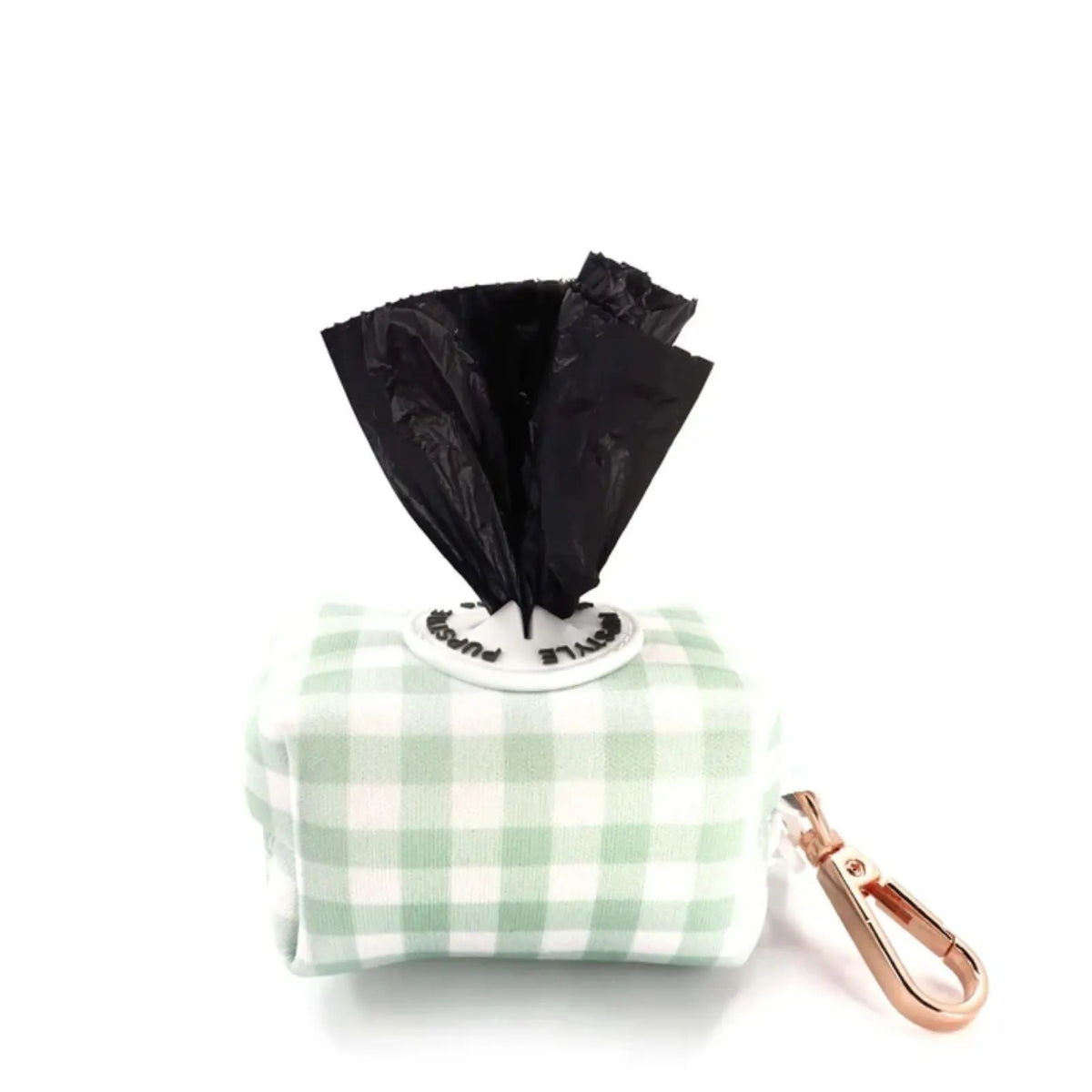 Pupstyle Sweet Apple colour Dog Poop Bag Holder with rose gold snap clip and white gingham pattern, a black plastic bag pulled out from the top, and a rose gold carabiner attached on the side, set against a plain white background.