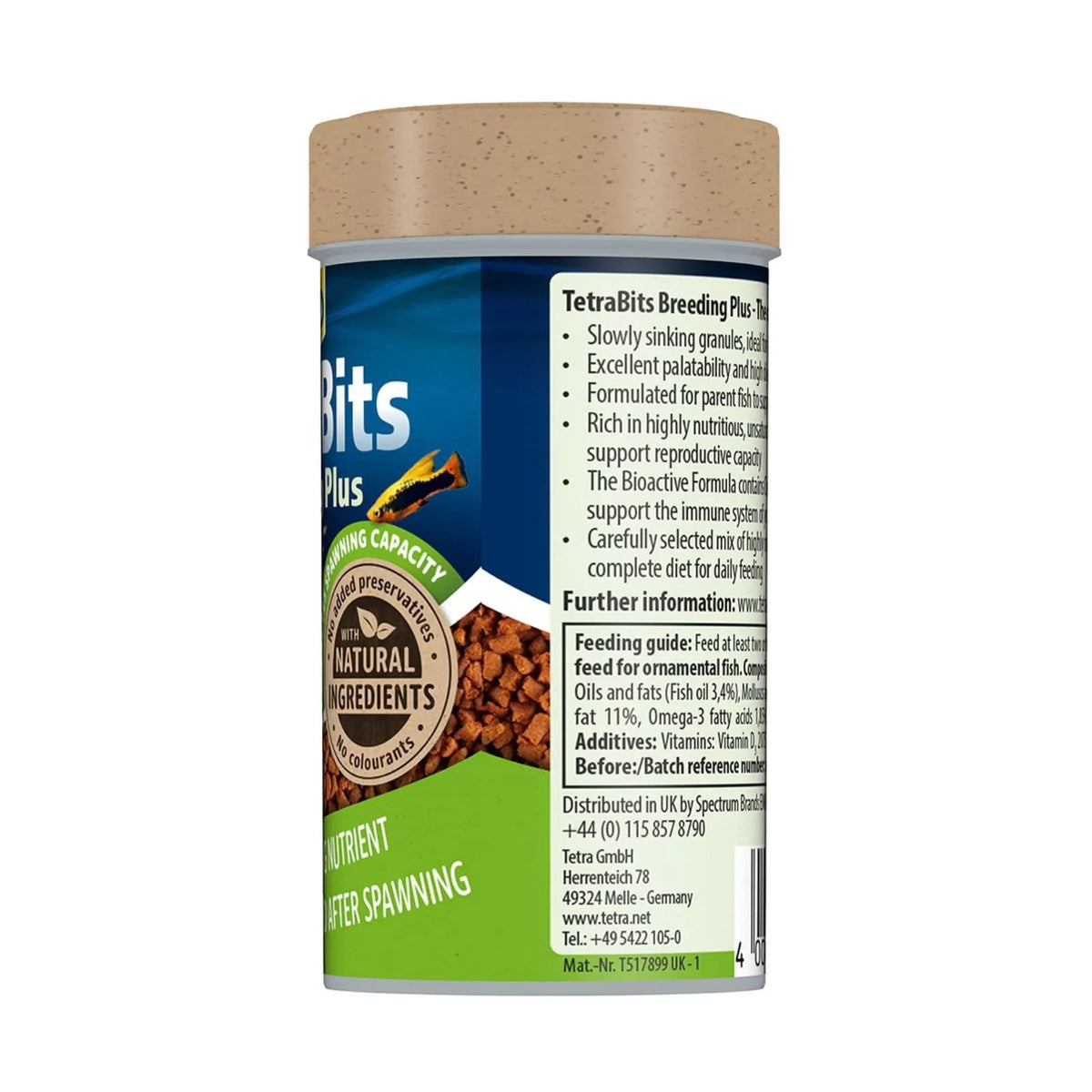A cylindrical bottle of TetraBits Plus After Spawning Nutrient for fish, showing the side label with text and a green and blue design with a beige cap.